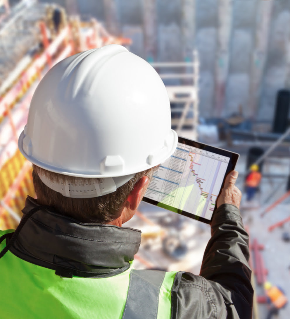 Engineer architect construction worker on construction site with tablet computer